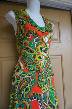 "Vintage 1970s maxi dress. No tags fits like a Medium. In good vintage condition. Please see measurements. Measurements taken across front laid flat - stretchy 19\" across front armpit to armpit 15\" across front of empire waist 24\" across hips 56\" length" Fitted Sleeveless Maxi Dress With Vibrant Print, Summer Vintage Print Maxi Dress, Retro Vintage Print Maxi Dress For Summer, Retro Maxi Dress With Vintage Print For Summer, Retro Summer Maxi Dress With Vintage Print, Retro V-neck Lined Maxi Dress, Fitted Bohemian Maxi Dress With Vibrant Print, Vintage Summer Maxi Dress With Retro Print, Retro Fitted Sleeveless Maxi Dress