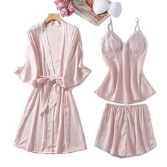 The New Summer Satin Silk 3 Piece Pajama Set Nightwear with Robe is made of a stretchy and soft fabric that feels great against the skin. The top has a sleeveless design with a V-neck and with some pretty white lacework, that makes it look even fancier. This 3 piece pajama set with a robe is available in multiple colors and sizes. This 3 piece pajamas set is all you need to help relax at home. They are soft and easy to touch which projects versatility and effortless grace in every step you take. Lounging Outfit, Silk Pajamas, Collars For Women, Silk Material, Pajamas Set, Satin Silk, Stretchy Material, Silk Satin, Nightwear