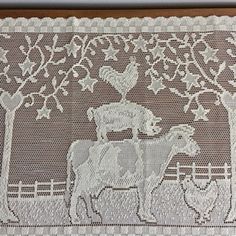 a white doily with an image of a horse and carriage