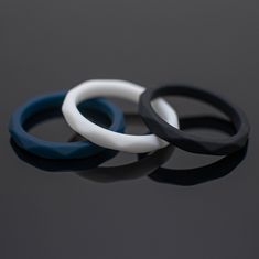 Your order comes with Three 2mm Width Women's Silicone Bands in + White + Black and + Midnight Navy Blue Made from Silicone to give you the best function and flexibility for any environment: whether hard working , the gym, leisurely relaxation, or everyday personal use. *Durable - Flexible silicone material to always look great *Comfort-fit - Comfortable and you won't notice you're wearing it. *Made to order - Every ring we ship is unique and one-of-a-kind. *2mm - Standard width. *Hypoallergenic Dimond Engagement Rings, Silicone Wedding Band, Silicone Rings, Silicon Bands, Hard Working, Midnight Navy, London Blue Topaz, Silicone Material, Blue Topaz