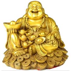 a golden buddha statue sitting on top of a pile of coins