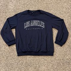 Shein Los Angeles California Lightweight Sweatshirt In Navy Blue Size Large. 22” Underarm To Underarm, 26” Long From Neckline To Bottom At Center Of Back. All Measurements Are Approximate And Taken Laid Flat. This Material Is Just A Little Heavier Than A Long Sleeved Tee. No Hang Tags But Come In Original Packaging. Only Removed For Pictures And Measurements. Blue Stretch Crew Neck Long Sleeve Top, Blue Stretch Tops With Letter Print, Long Sleeve T-shirt With Text Print For Loungewear, Blue Casual Long Sleeve Top For Fall, Casual Blue Long Sleeve Top For Fall, Blue Long Sleeve Trendy T-shirt, Trendy Blue Long Sleeve T-shirt, Blue Long Sleeve Crew Neck Top For Spring, Blue Crew Neck Long Sleeve Top For Spring