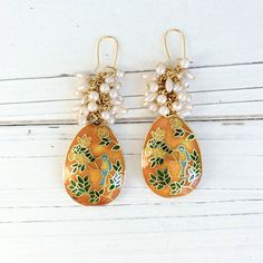 "Dangle statement earrings with absolutely divine cloisonne teardrop beads with bluebird and green leaves design suspended from a vintage stock pearl cluster. The gold and luster of the cloisonne give these dangle earrings a rich look. 3\" drop with gold-plated, nickel-free ear wires. Handmade in the USA.  Thanks for looking!" Bohemian Gold Enamel Earrings, Gold Hand-painted Teardrop Earrings, Gold Teardrop Earrings Hand Painted, Gold Hand Painted Teardrop Earrings, Meenakari Dangle Pearl Earrings, Elegant Hand Painted Teardrop Earrings, Pearl Cluster Earrings, Halloween Necklace, Muslin Bags