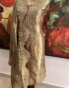 Item Overview ATHARVA Hand Woven Pure Tissue Silk Salwar Kameez/Aari Dori Embroidery/Gold Tissue/Heirloom Worthy/Custom Stitch Unstitch/Wedding/Plazzo/Gift/ Designer Wear Dno. SK2007 Fabric:  * Shirt: Pure Tissue Silk - Hand Embroidery/ 2.5 Mts Beautiful Aari Dori Work * Dupatta: Pure Tissue Silk - Hand Embroidery/ 2.5 Mts Beautiful Aari Dori Work/Elegant/Tassels/ * Bottom: Pure Tissue Silk 2.5 Mts. Excusive Hand Embroidered Party Wear Punjabi Suit. Customization: * Fabrics Customization: Designs Can be made in different Fabrics. *Color Customization: Designs Can be made in different Colors *Stitching Customization: 1. Salwar Kameez  2. Patiala Salwar Kameez  3. Churridar  4. Tunic Pants  5. Anarkali (Extra Charge) 6. Maxie (Extra Charge) 7. Plazzo Pants 8. Embroidered Pants or Salwars 9. Luxury Katan Silk Salwar Kameez With Dori Work, Semi-stitched Gold Chanderi Lawn Suit, Semi-stitched Raw Silk Kurta With Dabka Work, Semi-stitched Chikankari Kurta For Reception, Multicolor Embroidered Anarkali Set For Wedding, Semi-stitched Silk Kurta For Designer Wear, Designer Silk Salwar Kameez With Zari Work, Silk Sets With Multicolor Embroidery For Wedding, Raw Silk Dress With Multicolor Resham Embroidery