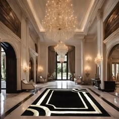 an elegant foyer with chandelier and marble flooring is seen in this image