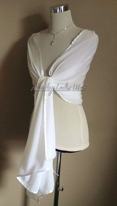 "All of our items are handmade and unique to our company.  Beautiful light ivory/off white chiffon shawls with a satin trim Perfect to drape or wrap around your arms and shoulders.  Fantastic for weddings and formal occasions! Approximate measurements 78\" Long  27\" Wide Lots of other styles/colours available, click on link below to view my Etsy shop -  https://www.etsy.com/uk/shop/dazzlingladieswear?ref=hdr_shop_menu Composition - 100% polyester Due to different screen settings, colours can appear different on different screens, therefore the shade of the item in person, may vary slightly in person to the shade you see on screen." Elegant White Formal Veil, Elegant White Veil For Ceremony, White Ceremony Veil, Elegant White Wedding Dress For Ceremony, Elegant White Ceremony Veil, Fitted White Bridal Accessories For Bridesmaids, Elegant White Bridal Accessories For Wedding, White Fitted Veil For Formal Occasions, Formal Fitted White Veil