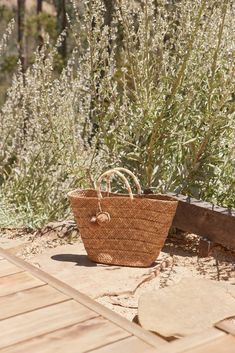 Introducing the Oversized St Tropez. Our best-selling tote now comes in an oversized version that is equally at home in the city as on the coast. Toss in your beach towel and sunscreen for weekend getaways, then use it to carry all your daily essentials once you're back home. Handcrafted from all-natural dried woven seagrass straw using a time-honored Filipino basketweaving technique. Features yarn-wrapped handles with coordinating raffia pompoms. Measures 22" W by 13" H by 6" deep with a 4.75" Natural Color Beach Bag With Rolled Handles For Vacation, Natural Beach Bag With Rolled Handles For Vacation, Beach Bags With Rolled Handles, Summer Beach Bags With Rolled Handles, Summer Beach Bag With Rolled Handles For Travel, Casual Beach Bag With Rolled Handles For Travel, Summer Travel Beach Bag With Rolled Handles, Eco-friendly Beach Bag With Rolled Handles, Casual Summer Beach Bag With Rolled Handles