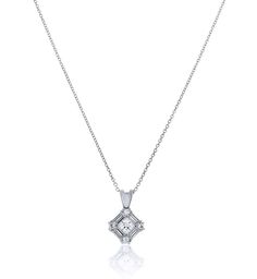 This stunning CZ pendant is diamond framed with Chandi Diamonds. Comes with necklace. 5A Grade Cubic Zirconia Chandi Diamonds Prong Set Rhodium Plated Chandi Diamonds Brilliant Cubic Zirconia Stones (CZ's) sourced by Bobby Schandra and featuring the highest grade CZ’s in the world. Chandi Diamonds are known for their brilliance and represent the top 5% of CZ’s available on the market today. Just like real diamonds, CZ’s have a number of Quality Levels based on cut, clarity, color and carat. Chan Formal Diamond White Necklace With Baguette Diamonds, Formal Diamond Necklace With Baguette Diamonds, Dazzling White Baguette Diamond Necklace, Elegant Silver Diamond-shaped Diamond Necklace, Exquisite Diamond White Diamond Necklace Pendant, Diamond Cut Pendant Necklace, Exquisite Diamond White Pendant Necklace, White Diamond Pendant Necklace With Baguette Diamonds, White Diamond Baguette Pendant Necklace