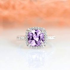 Gorgeous cushion cut amethyst ring is made of 925 solid sterling silver, making a simple but elegant statement piece. This ring is perfect to wear as engagement ring, promise ring, birthstone ring, or statement piece. ►Average band width: 2 mm ►True to size. ►Your sterling silver ring will not turn green itself and will not cause your skin to turn green. Center Stone: Amethyst Shape: Cushion Size: 8.0 x 8.0 mm Carat Weight: 2.5 ct. (approx.) Gemstone creation: Natural Hardness: 7 (Mohs scale) Ac Elegant Lavender Crystal Ring For Weddings, Elegant Lavender Crystal Wedding Ring, Classic Amethyst Promise Ring With Center Stone, Classic Amethyst Crystal Ring For Anniversary, Elegant Lavender Promise Rings, Elegant Lavender Birthstone Ring For Weddings, Classic Amethyst Birthstone Ring For Wedding, Classic Purple Diamond Promise Ring, Classic Purple Diamond Wedding Ring