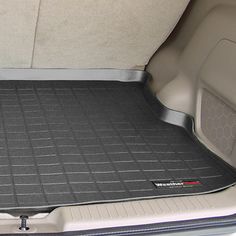 the trunk area of a car is clean and ready to be used