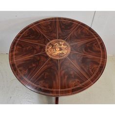 a wooden table with an intricate design on it