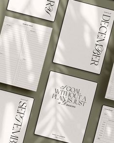 several pieces of paper with black and white writing on them, all lined up together