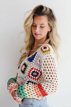 You'll be ready for dreamy days in the sun when you've got the Vibrant Crush Ivory Crochet Knit Top! This top features an array of bright, cheerful colors woven into an intricate crochet knit pattern, creating a unique, eye-catching design that adds texture and personality to any outfit. The button-front style offers versatility and ease of wear, allowing you to style it open over a tank or buttoned up for a more polished look. Crafted from soft, breathable yarn, this top provides comfort while Multicolor Open Knit Sweater For Vacation, Multicolor Knitted Sweater For Vacation, Knitted Multicolor Sweater For Vacation, Bohemian Knit Sweater For Vacation, Bohemian Multicolor Sweater For Beach, Bohemian Multicolor Beach Sweater, Multicolor Bohemian Beach Sweater, Multicolor Open Knit Beach Sweater, Multicolor Summer Sweater For Vacation