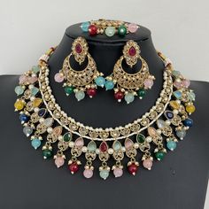 Multi Antique Polki Kundan necklace set/Reverse Ad Necklace/Statement necklace/Indian/Punjabi Necklace/Pakistani Jewelry/Bridal necklace/ Antique Reverse Ad Stone Necklace With Mehndi Plating Regular Size And Adjustable Stone Necklace Antique Necklace Set with dull gold finish  This is 100% Handmade jewelry. So Color, shades, texture displayed may slightly vary from the actual product due to digital image limitations. We request you to consider these minor variations. Please expect the possibility of some slight imperfections when buying hand made jewelry. If you have any questions, please message or email us. Arrives in gift box. Please let me know if you have any questions. Thank you so much visiting my shop. Multicolor Hand Set Kundan Necklace For Ceremonial Occasions, Ceremonial Multicolor Hand Set Bridal Necklace, Multicolor Temple Jewelry For Eid, Bollywood Multicolor Jewelry For Ceremonial Occasions, Heavy Multicolor Bridal Sets For Festive Occasions, Festive Heavy Multicolor Bridal Set, Multicolor Chandbali Jewelry For Eid, Bollywood Style Multicolor Jewelry Sets For Ceremonial Occasions, Multicolor Necklaces For Wedding And Diwali