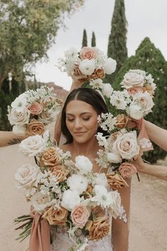 a woman holding flowers in front of her face