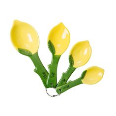 four yellow flower shaped utensils with green stems