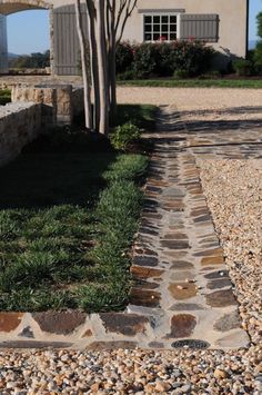 a stone path leading to a house