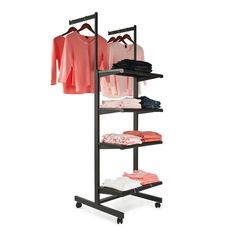 an ironing rack with clothes and shirts on it's sides, against a white background