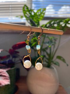 These gold pearl and blue glass bead earrings are a perfect staple in your closer and match with any outfit.  Channel the summer tropical beach vibes with these dainty minimalist earrings.  Handmade with care and detail, these will make you shine at any event, and are a great gift for her. Mermaidcore and cottage core vibes commence! Drop length: 2.2 in Free shipping on all my products 🍊🧡and a 21 day return and exchange policy. Don't hesitate to reach out to me for any questions! Summer Pearl Drop Earrings, Summer Pearl Dangle Earrings, Summer Pearl Drop Dangle Earrings, Handmade Dangle Pearl Earrings In 14k Gold Filled, Handmade 14k Gold Filled Dangle Pearl Earrings, Handmade 14k Gold-filled Dangle Pearl Earrings, Handmade Pearl Earrings For Summer, Summer Beach Earrings With Wire Wrapped Detail, Dainty Everyday Earrings For Summer