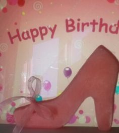 a pink birthday card with a high heel shoe