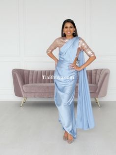 Don't you just love the versatility of a saree? Here's a simple but elegant Dress Drape! Elegant Fitted Pre-draped Saree For Wedding, Elegant Formal Art Silk Pre-draped Saree, Elegant Silk Pre-draped Saree For Wedding, Festive Satin Pre-draped Saree For Formal Occasions, Pre-draped Satin Bridesmaid Gown, Fitted Satin Finish Bridesmaid Gown, Silk Bridesmaid Dress With Fitted Bodice, Satin Gown With Draped Sleeves, Glamorous Silk Dress With Traditional Drape