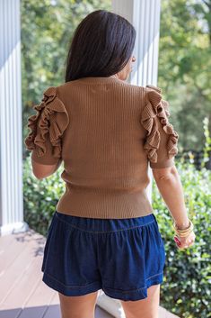 Toffee brown knit sweater top with ruffled puff short sleeves Ruffled Feelings and a sassy attitude is what this cute babe brings, because we're so ready for Fall! Introducing our new fave sweater, featuring toffee knit and short ruffle puffed sleeves - she'll add a touch of whimsy to any day out! Perfect dressed up with a skirt and heels, or worn casually as shown here: Shorts True to size fit Model is 5'3" wearing a small Fabric contains stretch Ribbed crew neckline Ribbed cuffed short ruffled Trendy Short Sleeve Ruffled Knit Top, Trendy Ruffled Short Sleeve Knit Top, Trendy Short Sleeve Knit Top With Ruffles, Trendy Ruffled Knit Top For Fall, Brown Knit Short Sleeve Sweater, Brown Short Sleeve Knit Sweater, Brown Ruffled Top With Short Sleeves, Fitted Brown Tops With Ruffles, Fitted Brown Ruffled Tops