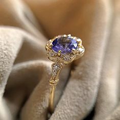 Art Deco Diamond & Tanzanite Engagement Ring in Solid Gold, Vintage Diamond Halo Ring, Tanzanite Bridal Ring, Minimal Promise Ring for Women by NUUMUJEWELRY on Etsy Ring Minimal, Tanzanite Engagement Ring, Diamond Halo Ring, Evil Eye Ring, Natural Tanzanite, Art Deco Diamond, Halo Diamond Ring, Gold Polish, Bridal Ring