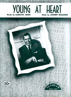 the cover of young at heart, with an image of a man in a suit and tie