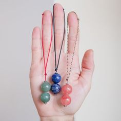 This BaeJuju is your multi-use crystal companion! Have it with you as a bracelet & remove it to utilize as a toy or a pendulum. The stones are free to move so it can transformed in a variety of ways:⚪️〰️⚪️ - Beads separated to be used as a begleri (Greek skill toy)⚪️⚪️〰☝️ - Beads together to swing as Longshot (fidget/skil toy)🔔 - Beads together to hang as a pendulum🤲 - Back to bracelet whenever done!⠀ Great for:▪️ Relaxing▪️ Stress relief▪️ Finger dexterity▪️ Fidgeting▪️ Meditation⠀ We use Adjustable Everyday Crystal Necklaces, Adjustable Crystal Necklaces With 8mm Beads For Gifts, Adjustable Crystal Necklaces With Round Beads For Everyday, Everyday Adjustable Crystal Necklaces With Round Beads, Multicolor Beaded Bracelets, Pony Bead Patterns, Diy Crystals, Bracelet Gemstone, Wire Rings