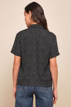 It's easy to dress for success when you have the Lulus Good Luck Charm Black Polka Dot Short Sleeve Button-Up Top in your closet! This classic collared top has a full button and loop placket running the length of its breezy, woven fabric bodice. This sweet little top keeps the charm going with its boxy silhouette and front patch pocket, perfect for transitioning between casual cool and office chic! Fit: This garment fits true to size. Length: Size medium measures 24" from top to bottom. Bust: Great for any cup size. Waist: Not Fitted - comfortable room throughout midsection. Undergarments: May be worn with any standard bra. Fabric: Fabric has no stretch. Unlined and slightly sheer. 100% Polyester. Hand Wash Cold. Do Not Bleach. Line Dry. Iron Low Heat. Imported. Lulus | Good Luck Charm Bla Polka Dot Button-up Blouse For Work, Polka Dot Blouse With Button Closure For Workwear, Polka Dot Collared Blouse With Button Closure, Black Tops With Collared Neckline And Buttons, Black Tops With Buttons And Collared Neckline, Black Top With Button Closure And Collared Neckline, Black Tops With Buttoned Collared Neckline, Black Collared Top With Buttons, Black Collared Top With Button Closure