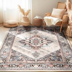 a large rug with an ornate design on the floor in front of a chair and potted plant