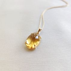 This stunning pendant is set in 14k Solid Yellow Gold with Natural Citrine with utmost precision. It is a unique gemstone pendant for nearly every occasion and is completely hassle-free jewelry. ITEM DETAILS: * GEM: Citrine * GEM Size: 13X18mm * GEM Shape: Oval * Gem Weight: 11.26 carats * Gold Purity: 14KT  * Gold Weight: 0.93 gram * Total Weight of the Pendant: 3.18 gram The Gold purity is guaranteed and it comes with an authentic 14KT gold hallmark. Since my items are handmade, they are absol 14k Gold Oval Amber Jewelry, Luxury Amber Oval Necklace, Elegant Oval Amber Necklaces, Elegant Citrine Oval Pendant Necklace, Oval Citrine Amber Necklace, Yellow Gold Citrine Oval Pendant Jewelry, Oval Amber Citrine Necklace, Elegant Oval Citrine Necklaces, Yellow Gold Oval Jewelry With Large Stone