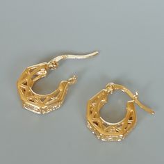 A PAIR of filigree sterling silver ear hoops. These hoops are dipped in gold. Size: 16 x 14 x4 mm Weight: 2.95 gm Price listed is for ONE PAIR These are made of 925 hypoallergenic sterling silver. Most of my pieces come with a 925 stamp. Can be packaged in a gift box. I can include a personal message from you if needed You are welcome to contact me at... bhavnakwintra1956@gmail.com For more beautiful pieces from my shop, please browse 👇 TOE RINGS: https://www.etsy.com/your/shops/TheSilverGame/t Gold Dainty Pierced Hoop Earrings, Dainty Yellow Gold Metal Hoop Earrings, Dainty Gold Pierced Hoop Earrings, Nickel-free Gold Metal Huggie Earrings, Anniversary Gold Huggie Earrings Pierced, Nickel Free Gold Plated Round Huggie Earrings, Gold Plated Nickel-free Round Huggie Earrings, Metal Small Hoop Huggie Earrings For Gift, Small Hoop Metal Huggie Earrings For Gift