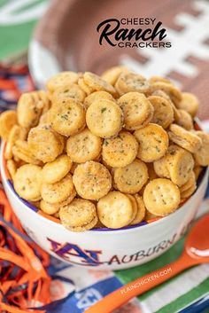 cheesy ranch crackers in a bowl on a table with orange streamers