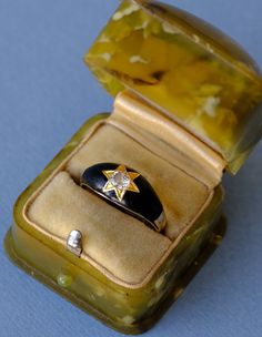 A stunning classic mourning memorial ring, made of 14ct yellow gold (Marked 585) and black enamel, dating back to the late Victorian period, circa 1880s. This striking ring features a sparkling white old European cut diamond claw set in a star setting in yellow gold within black enamel at the center. The shrank is plain. Condition: Very good antique condition with black enamel in good condition Size: Approx. 5.4 US or approx. K-K ½ UK, inside diameter: approx. 16 mm Weight: 3.42 grams ☞  Rings are shipped in antique style velvet boxes that are reproductions of the ones used in 19th century. Victorian Hallmarked Enamel Ring For Wedding, Victorian Enamel Ring For Anniversary, Victorian Style Hallmarked Enamel Ring For Anniversary, Victorian Style Hallmarked Enamel Ring For Wedding, Antique Hallmarked Enamel Wedding Ring, Art Deco Yellow Gold Enamel Ring For Formal Occasions, Art Deco Formal Yellow Gold Enamel Ring, Formal Yellow Gold Art Deco Enamel Ring, Formal Art Deco Yellow Gold Enamel Ring