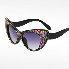 Introducing the all-new Jewel embellished update to our fave Kandi glasses! We can't get enough of these right now!Get ready to shine with our Kandi Lux sunglasses - the trendiest and most unique sunglasses you'll find. With their designer-inspired look, you'll stand out from the crowd wherever you go! Perfect Fit - Soft adjustable nose pads, spring hinges, flexible arms make the sunglasses very comfortable to wear. Original & Elegant - Our sunglasses are durable and fashionable and fit for ever Fun Black Sunglasses For Parties, Spring Party Cat Eye Sunglasses With Tinted Lenses, Modern Cat Eye Sunglasses For Spring Party, Spring Party Cat Eye Tinted Sunglasses, Multicolor Sunglasses For Summer Parties, Fun Cat Eye Sunglasses For Party, Fun Cat Eye Sunglasses For Parties, Multicolor Party Sunglasses For Summer, Summer Party Polarized Cat Eye Sunglasses