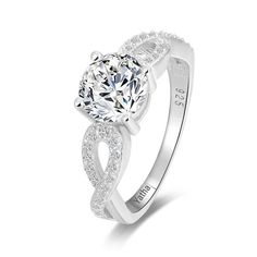 a white gold engagement ring with an oval cut diamond center and pave set shoulders