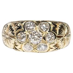 a gold ring with diamonds on it