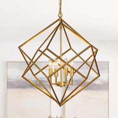 a gold chandelier hanging from the ceiling