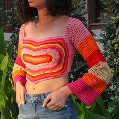 This crochet long sleeve top combines sustainability and elegance. The colorful crop top offers an eco-friendly and stylish option. It gives an active and dynamic look with its crocheted heart top details. Women who are fond of pink, we hear you.  📌 Quick wipe to clean 📌 Premium quality knit 📌 Careful craftmanship 📌 %100 handmade. 📌 Curated especially for you. 🎁International fast and free shippingThis crochet shirt combines sustainability and elegance. 🌻Product Details: This crochet long sleeve top is knit with all-natural materials and enhanced with vegan leather details. This colorful crop top is both comfortable and stylish and is the ideal size for everyday wear. 🌱 Sustainability: Aligned with sustainable fashion principles, this Long sleeves crop top represents eco-conscious c Fashion Principles, Heart Crop Top, Crocheted Heart, Crochet Long Sleeve Tops, Crop Top Crochet, Long Sleeve Crochet, Crop Top Pink, Knitted Crop Top, Knitting Group