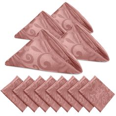 six pink napkins with an intricate design on the front and back of each one