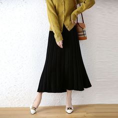 Midi, high-waist, A-line type, solid, pleated, cashmere knit skirt - available in 4 colors. MATERIALS · 100% Cashmere CARE Hand wash at max. 30ºC/86ºF Do not use bleach Iron at a maximum of 110ºC/230ºF Do not dry clean Do not tumble dry Autumn Skirt, Empire Dresses, Striped Midi Skirt, Winter Skirt, Empire Dress, Black Midi Skirt, Fall Skirts, Line Patterns, Knit Skirt