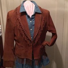 Stunning Cognac Colored Suede Jacket With Fringe Detail. Two Front Pockets, Single Snap Front Closure. Fully Lined. Western Style Long Sleeve Workwear Outerwear, Western Style Long Sleeve Outerwear For Work, Western Style Workwear Outerwear, Fitted Western Leather Jacket With Long Sleeves, Winter Leather Jacket For Rodeo With Long Sleeves, Winter Leather Jacket For Rodeo, Vintage Long Sleeve Outerwear For Rodeo, Western Style Fitted Blazer For Fall, Western Style Long Sleeve Fitted Blazer