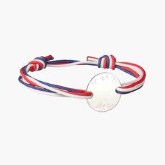 Our Men's Personalized Olympic Bracelet is a fun way to represent a country in bracelet form. Choose three colorful braid colors to represent your flag and pair with a hand-engraved disc. Add names, dates, and words for an extra-special touch to this unique bracelet.&nbsp;925 Sterling SilverCharm: 0.8”x0.8”Braid made of durable, colorfast polyesterSize: between 8-9, fully adjustable sliding knot fasteningEngraved by hand in our Paris workshopSent with love in a complimentary gift boxAny slight variations in lettering depth, spacing and alignment from the examples shown are part of the aesthetic and originality of the piece Adjustable Engraved White Bracelets, White Adjustable Engraved Bracelets, White Engraved Adjustable Bracelet, Braid Colours, Braid Colors, Crystal Dice, Birth Gift, Grandmother Gifts, Zodiac Constellations