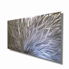 an abstract painting with white and blue colors on the canvas, hanging on a wall