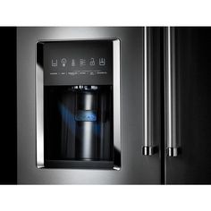 a stainless steel refrigerator with water dispenser and ice maker on the door