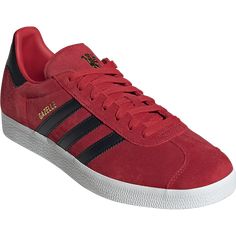 adidas Gazelle Manchester United Soccer Shoe Manchester United. Show your support for Manchester United with a timeless shoe, dedicated to the Red Devils. Experience adidas Originals comfort and a crispy clean design with these low-profile men's shoes. Created for a classic fit, the supple suede upper adds a touch of subtle texture. Meet the world with a discerning taste, stay on the move, and enjoy all-day comfort with the iconic three-stripe detailing and a cushioned insole. Classic University Red Sneakers With Rubber Sole, Classic Lace-up Sneakers In University Red, Adidas Red Sneakers With Three Stripes, Red Adidas Sneakers With Round Toe, Red Adidas Sneakers With Three Stripes, Classic University Red Sneakers With Cushioned Footbed, Red Sneakers With Three Stripes For Sports, Lace-up Adidas Sneakers In University Red, Red Adidas Sneakers With Synthetic Material