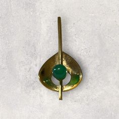 Vintage art deco inspired pendant with green accent Hold to slide the chain on In Excellent condition  Gold Filled  Measurement : 1 5/8" length Modernist Gold Brooch Jewelry, Modernist Gold Brooch, Green Rectangular Pendant Jewelry For Formal Occasions, Green Rectangular Pendant For Formal Occasions, Green Metal Jewelry For Formal Occasions, Handmade Retro Green Jewelry, Formal Green Metal Jewelry, Green Metal Pendant Jewelry, Green Teardrop Pendant Jewelry For Formal Events