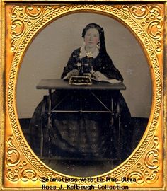 an old photo of a woman sitting at a table with a typewriter in front of her