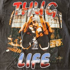 a black t - shirt with the words thug life on it